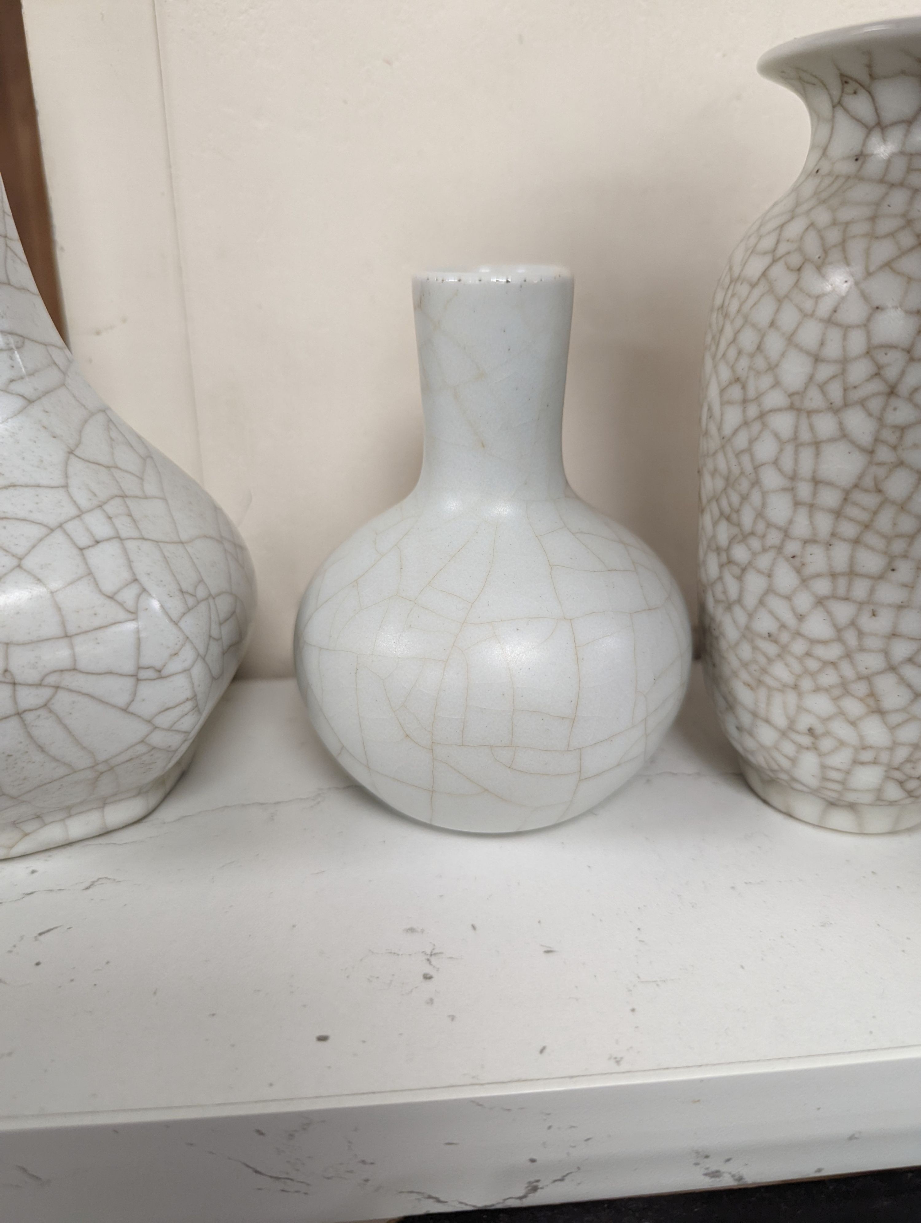 Four Chinese crackle glaze vases, tallest 16 cms high.